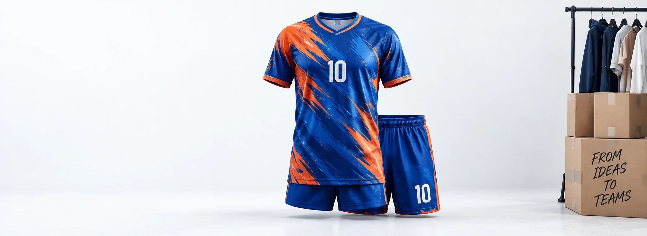 Complete blue and orange team kit beside a clothing rail and boxes marked From ideas to teams